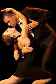 a man and a woman giving a tango performance