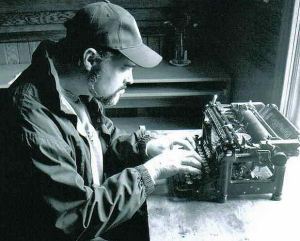 writer at work at typewriter