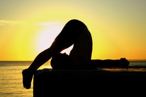 yoga pose at sunrise