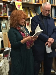 Libby Sommer reading from her book while Stephen Matthews listens