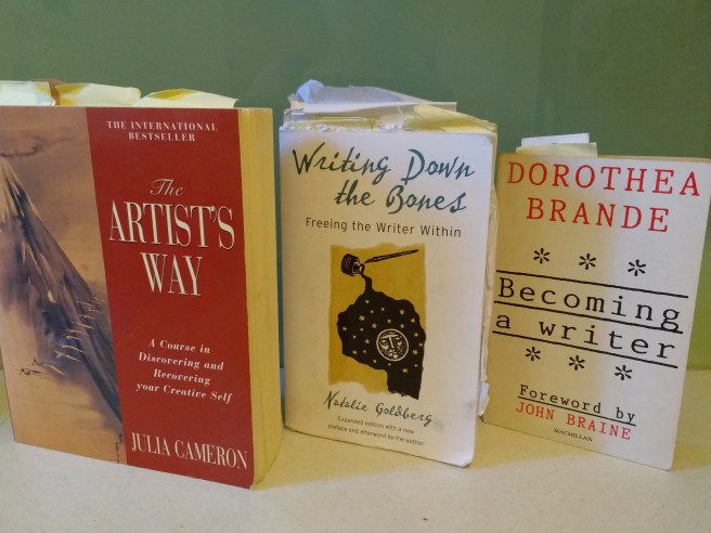 three book covers: The Artist's Way, Writing Down the Bones, Becoming a writer