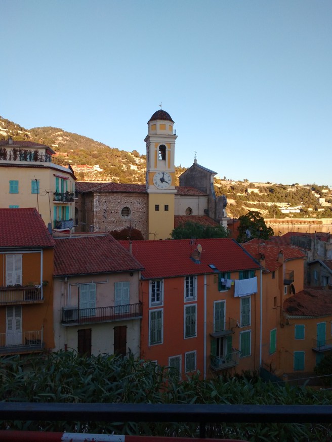 houses and clock in Villefranche sur Mer