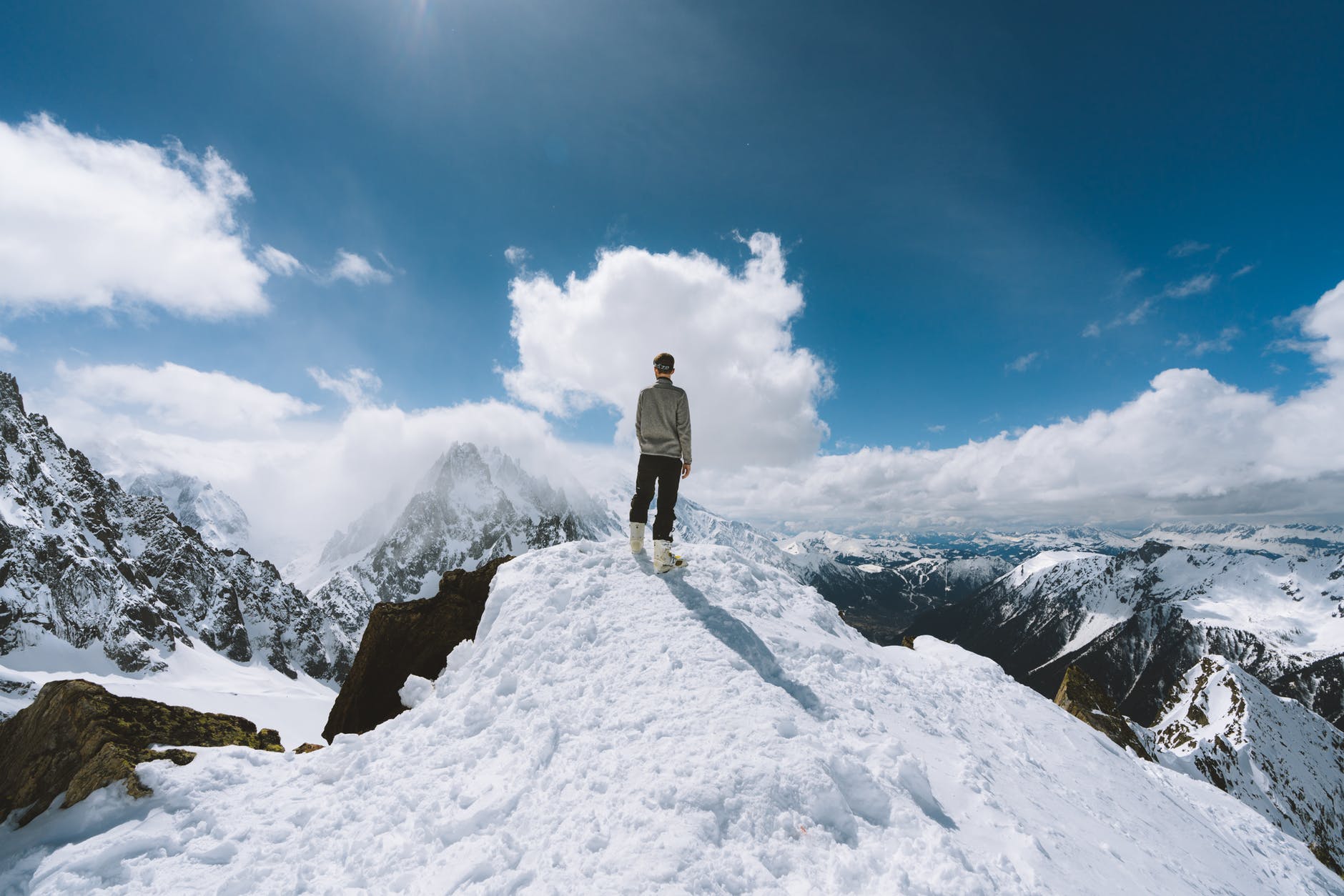 person standing on slope glacier mountain