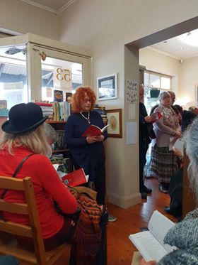 reading from Wild poetry anthology in bookstore