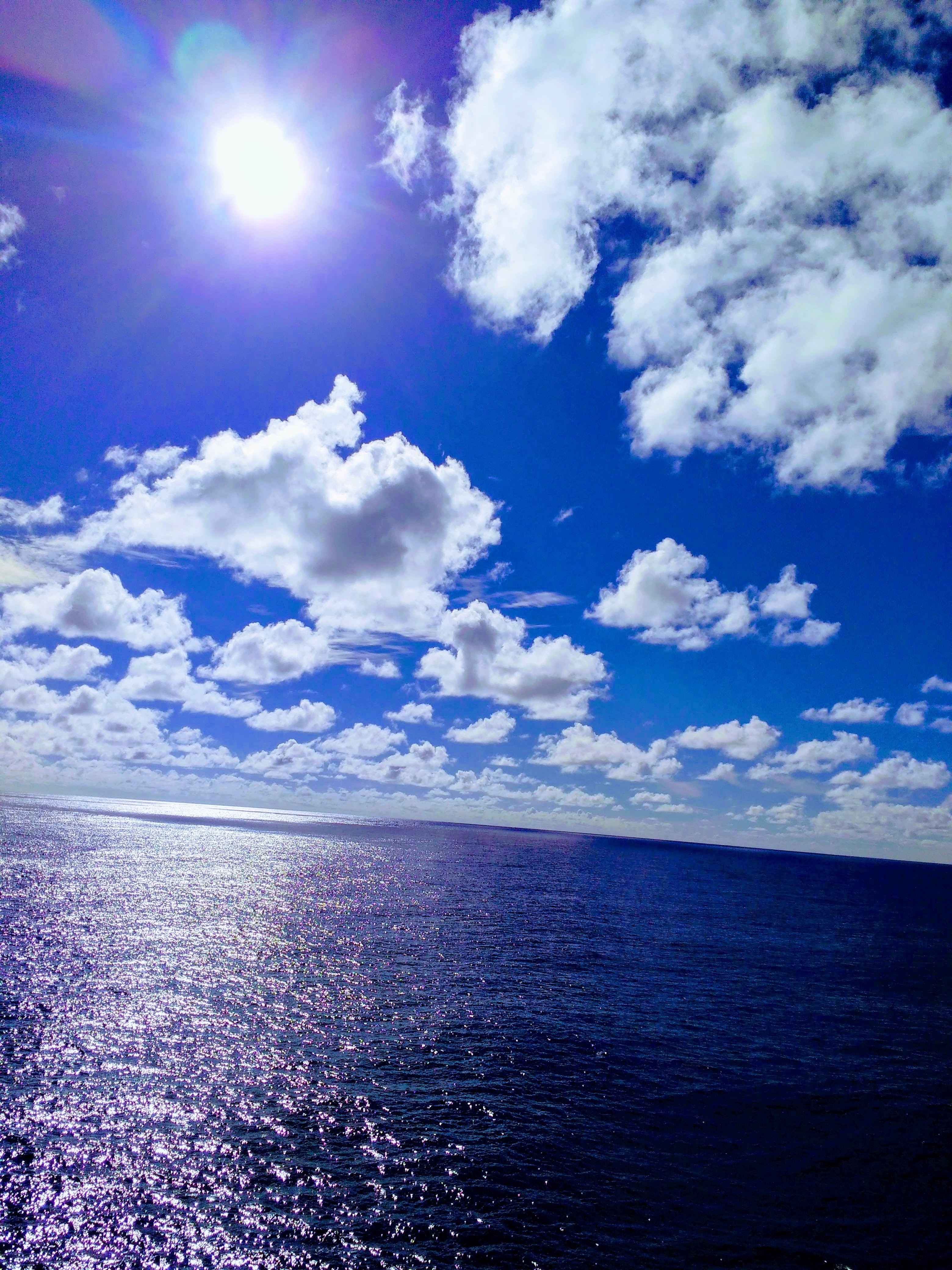 sky, clouds, rising sun over Pacific Ocean