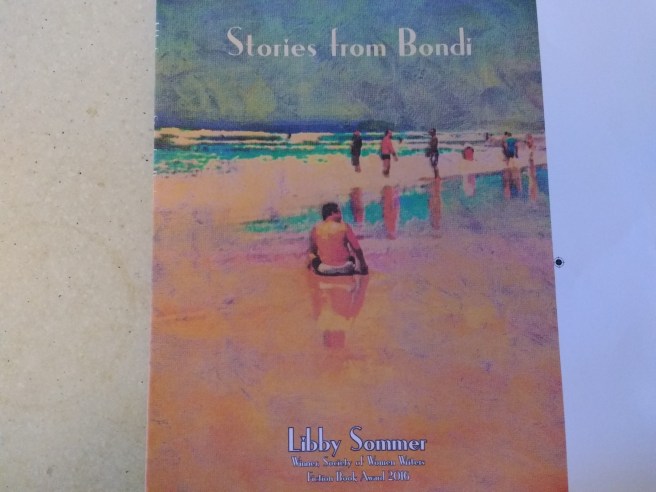 book cover of 'Stories from Bondi' showing people on the sand by the sea